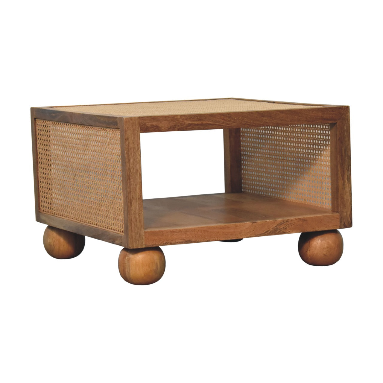 Angled corner view of a wooden coffee table with rattan sides, a box-shaped design, and four rounded ball feet for support.