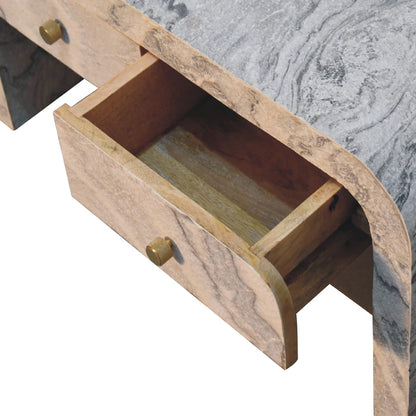 Close-up of one open drawer on a marble-effect coffee table, showing the brass round knob and detailed stone-like finish.