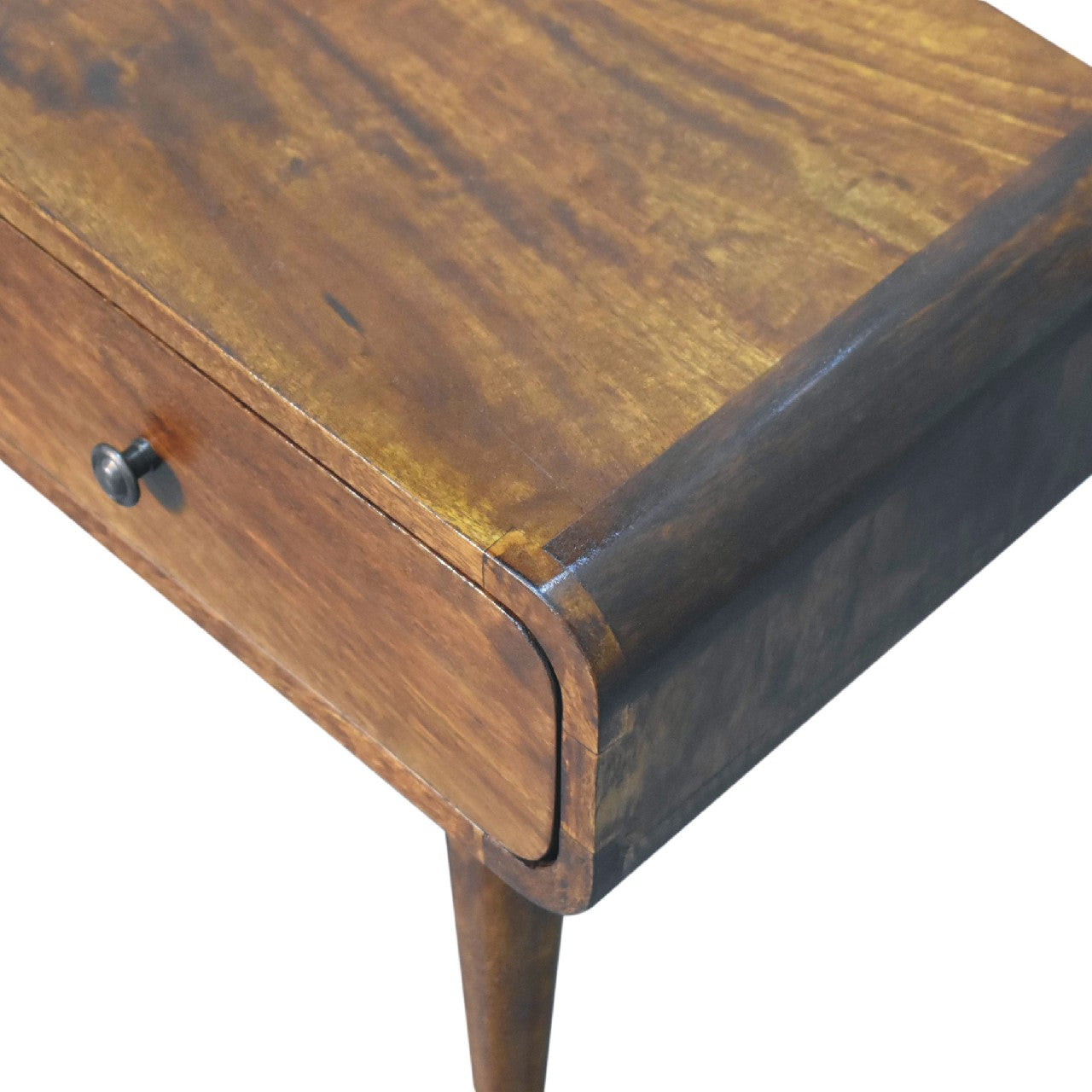 Close-up of the tabletop surface corner with rich walnut-toned wood grain.