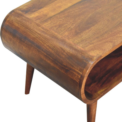 Overhead view of a wooden coffee table with a flat polished surface, curved edges, and an open shelf below.
