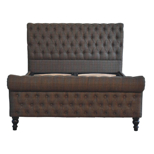 Tweed padded upholstered bed frame with a tall headboard against a white background