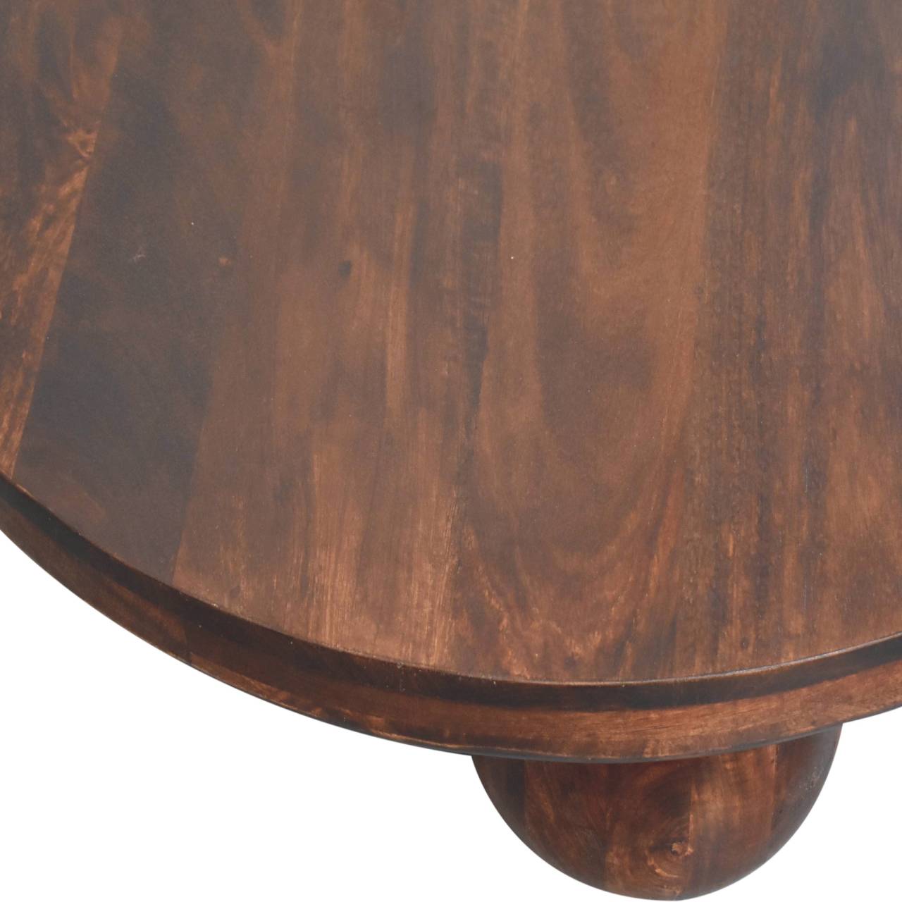 close up of top of round wooden coffee table