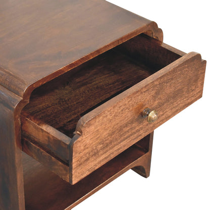 Close-up of the open single drawer with rounded brass knob and curved edging design.