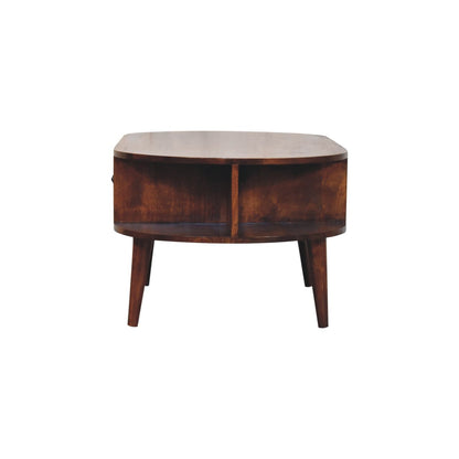 Side profile of the wooden coffee table, highlighting its smooth oval shape, 2 open storage compartments and mid-century design.