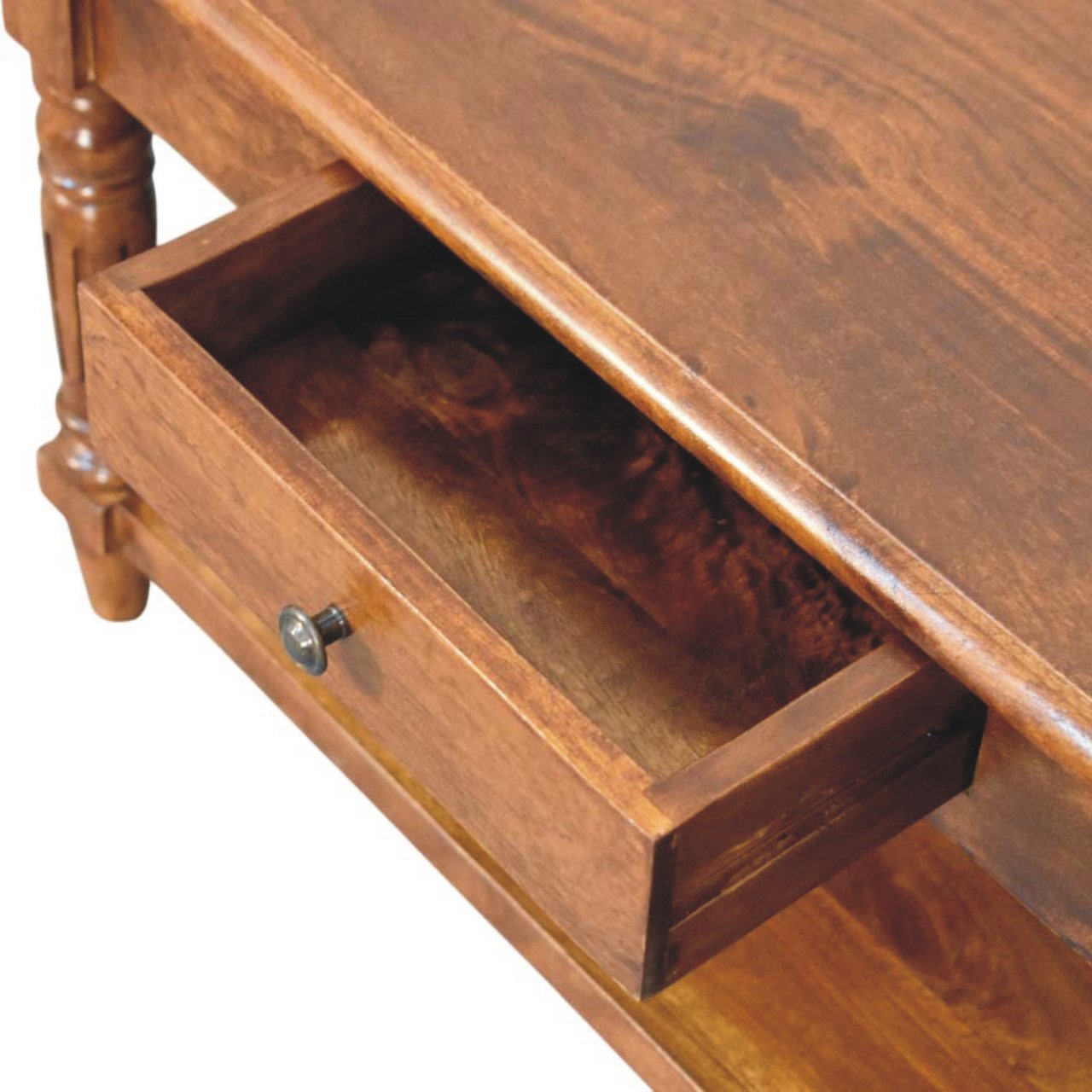 Close-up of the small central drawer which has been opened, featuring a round knob handle set within the wooden frame of the table.