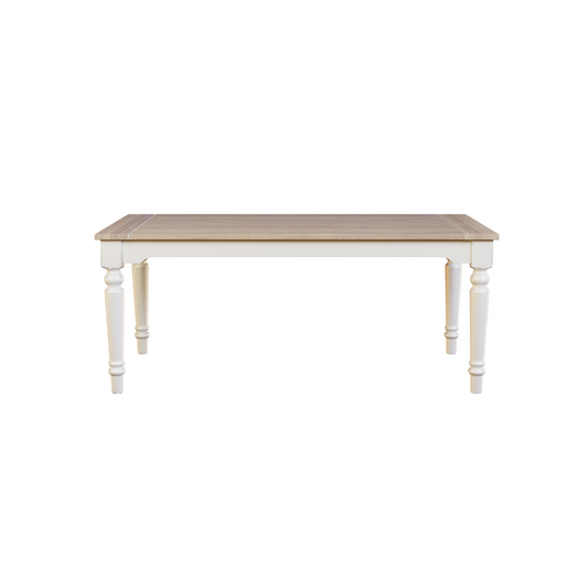 A rectangular white dining table with a wooden top and decorative legs.