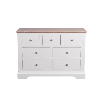 A white Laura Ashley Dorset 3+4 Drawer Chest with a wooden top against a white background