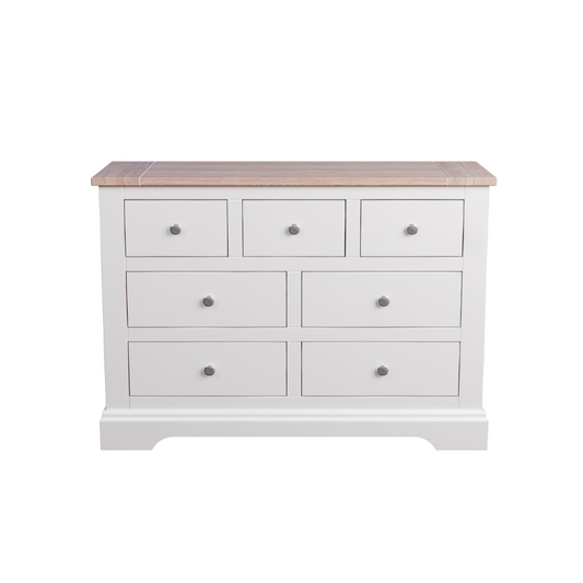 A white Laura Ashley Dorset 3+4 Drawer Chest with a wooden top against a white background