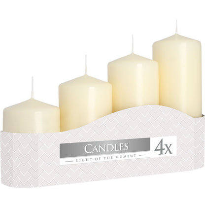 Set of four white candles in a decorative box with 'Candles Light of the Moment' branding.