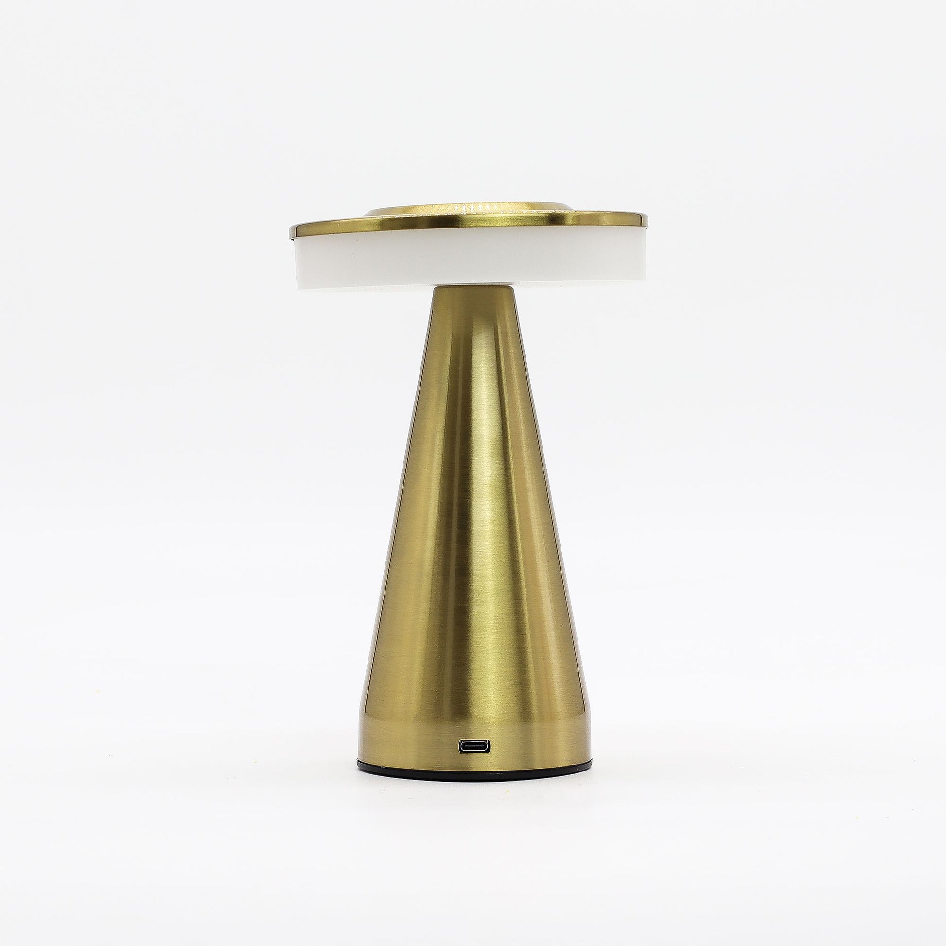 Gold table touch lamp with white shade on a white background