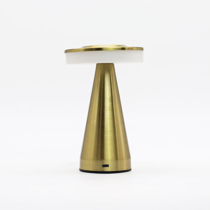 Gold table touch lamp with white shade on a white background