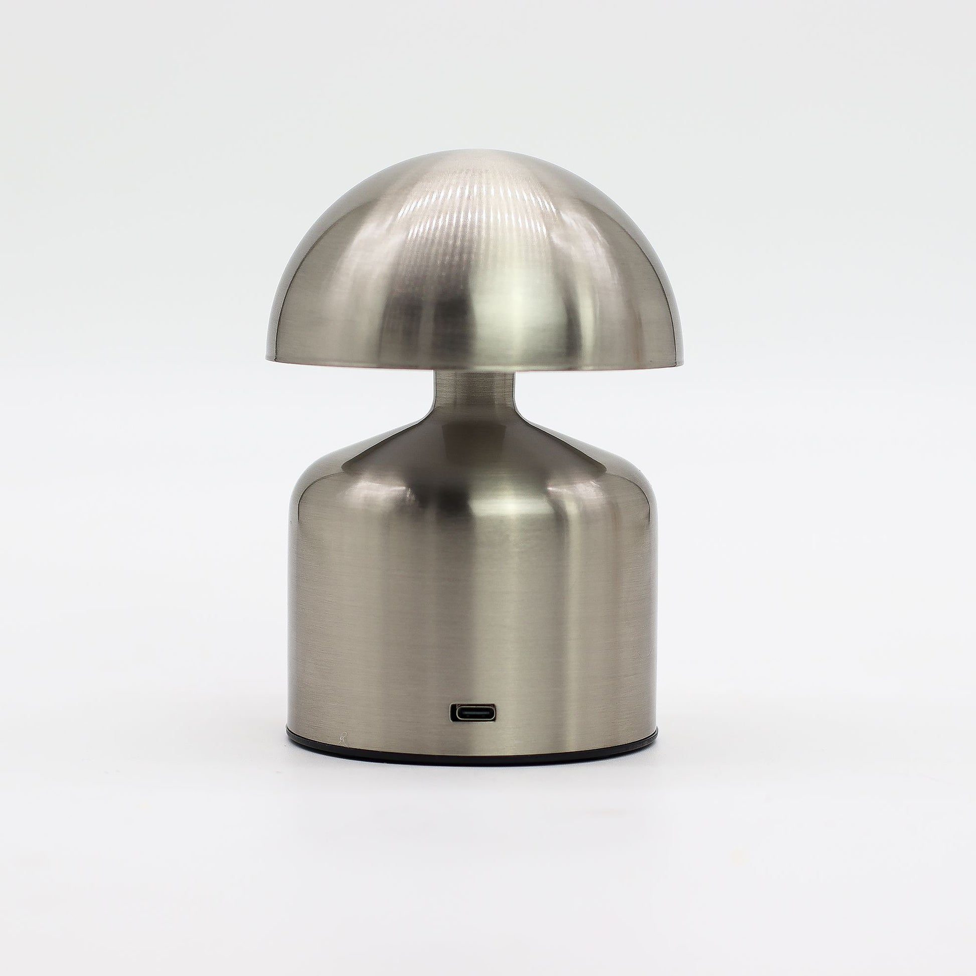 Metallic table lamp with a unique dome-shaped design on a white background
