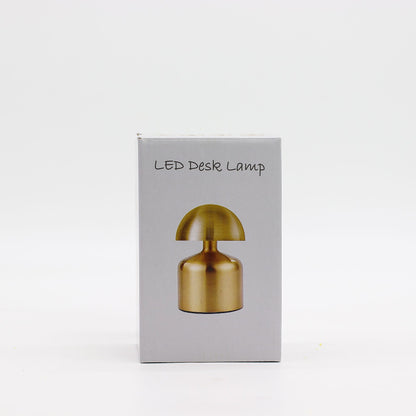 Box for LED desk lamp with gold lamp illustration on a white background