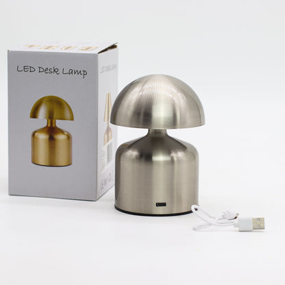 Metallic desk touch lamp with packaging on a white background