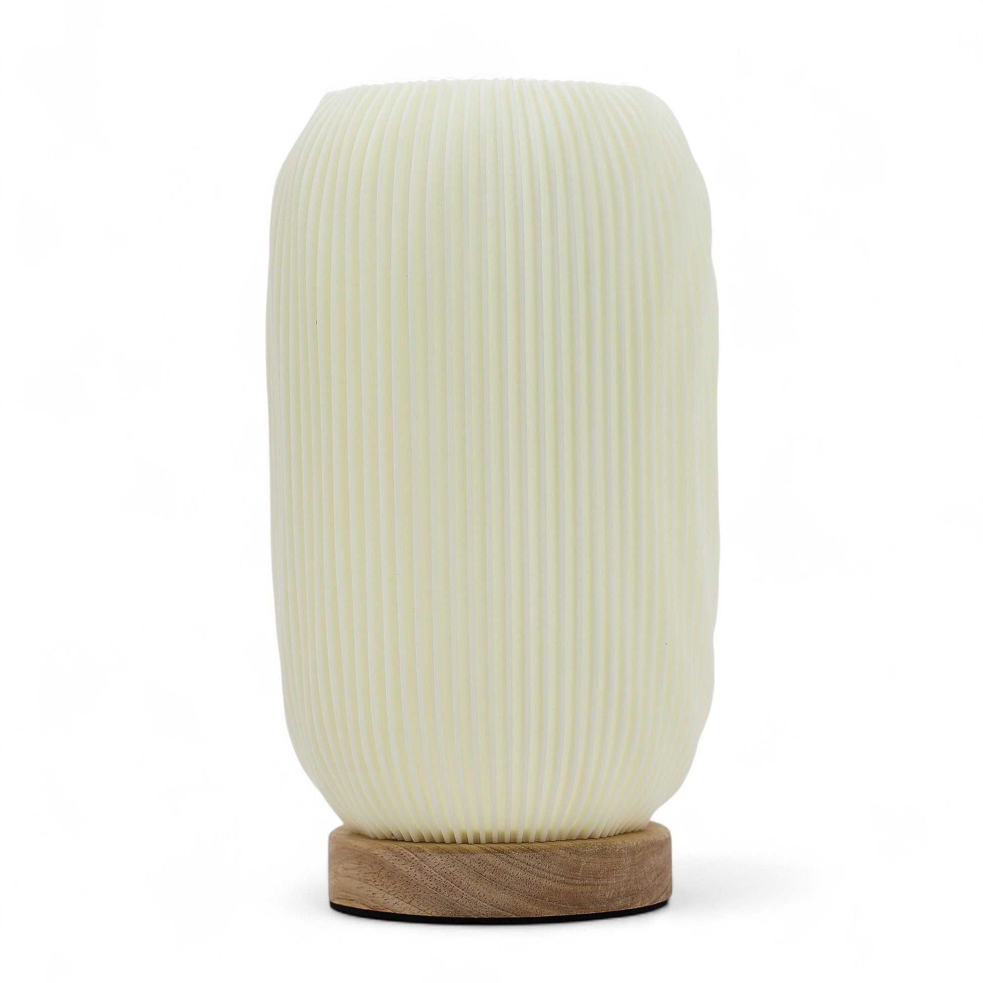 White textured table lamp with wooden base on a white background