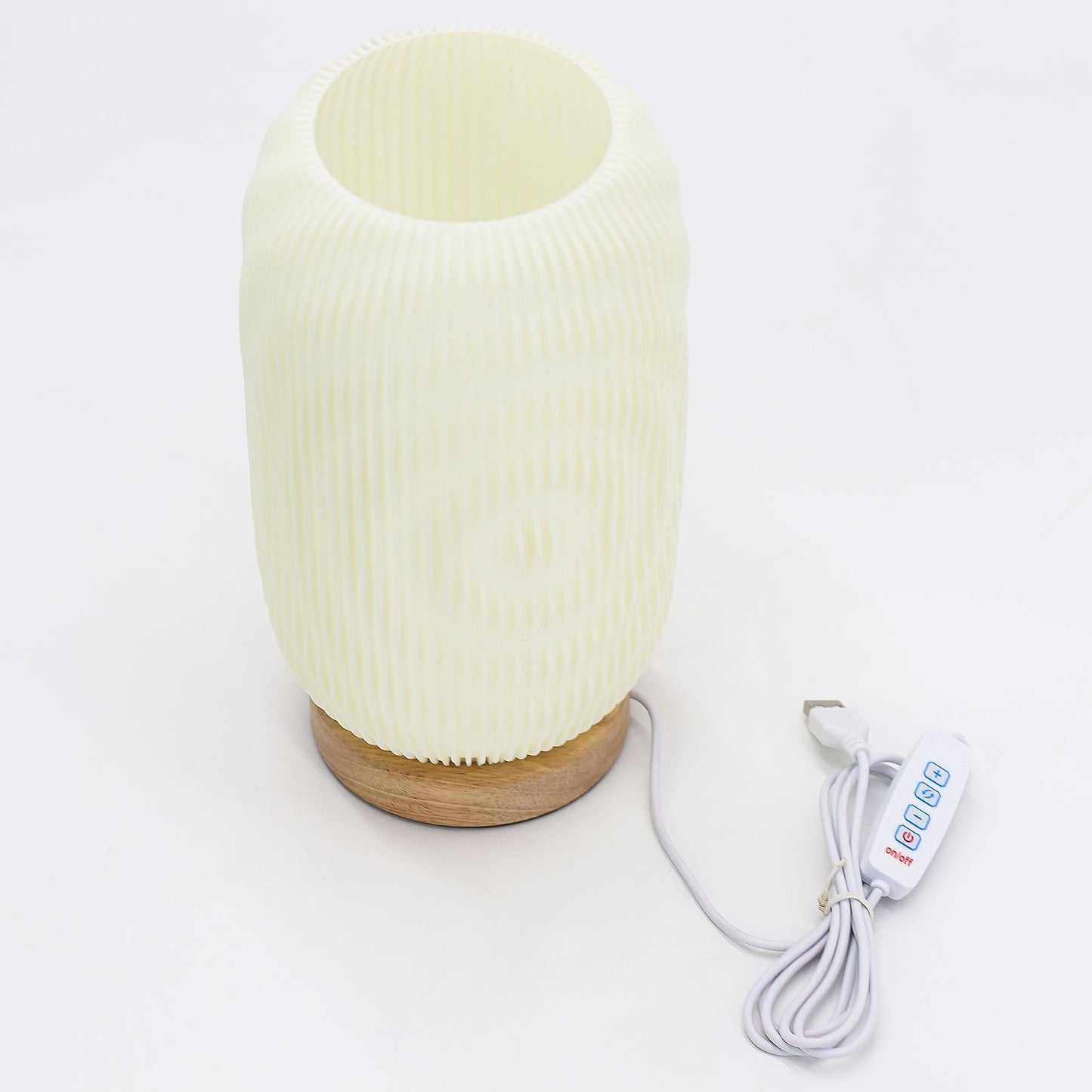 White textured diffuser with wooden base and control cable on a white background