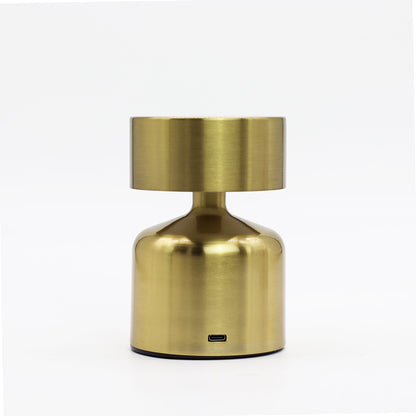 Gold metallic rechargeable table touch lamp on a white background