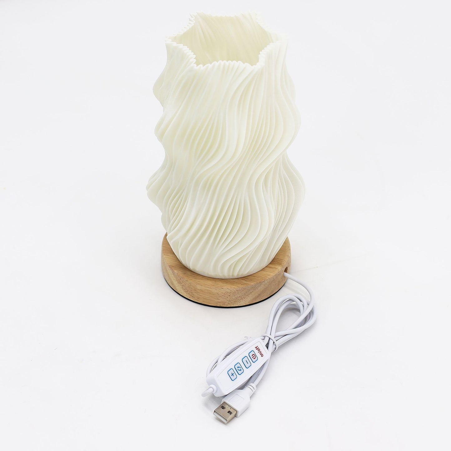 White textured lamp with wooden base and USB cable on a white background