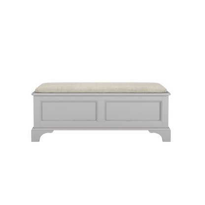 A dove grey blanket box with a cushioned top and wooden body, designed for storage and seating.