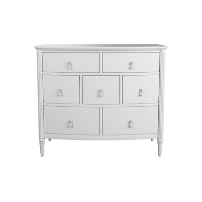 A whitewashed oak chest of drawers with a simple traditional design and metal handles.