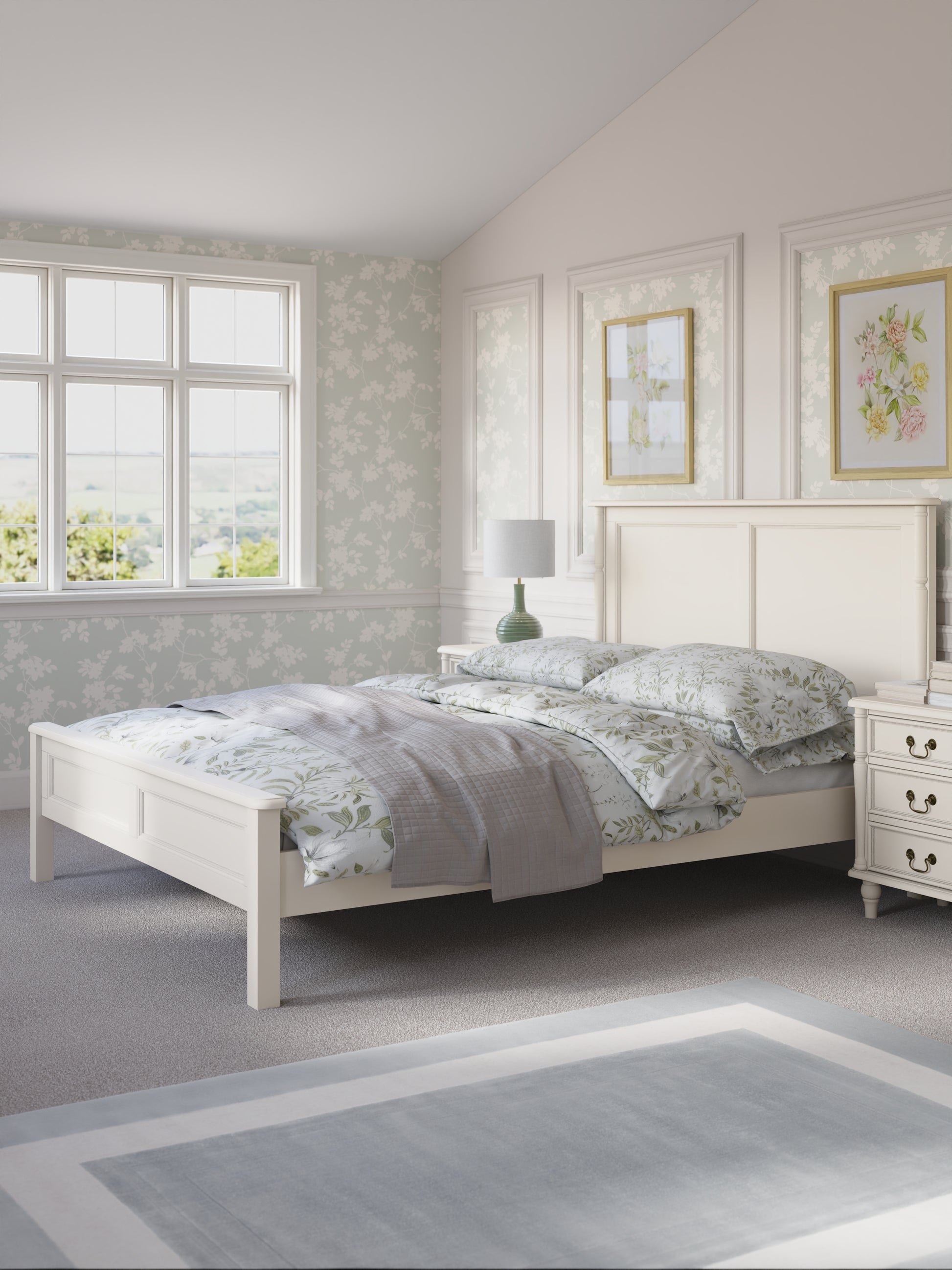 Bedroom with a white bed and floral bedding in a light setting.