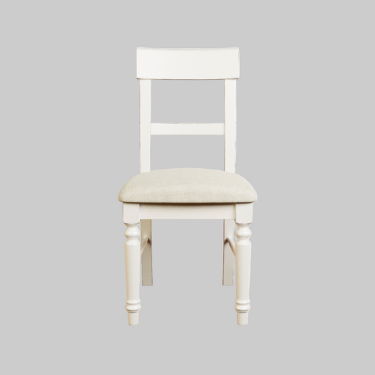 A white upholstered dining chair with a full back and seat, featuring a wooden frame and legs.