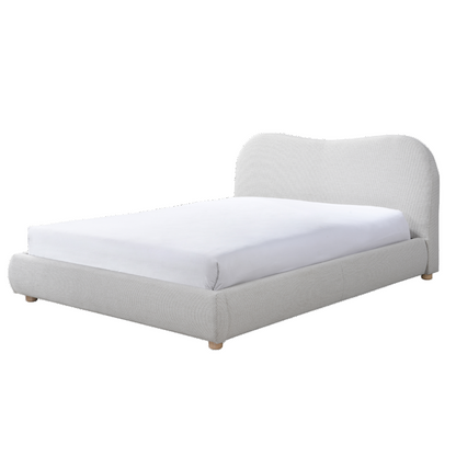 Gray upholstered bed with white mattress on a white background